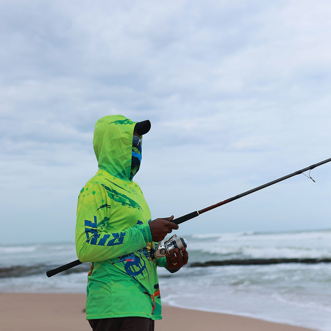 Angler Hanish standing in hot sun trying to feel effect of UPF sun protection clothing