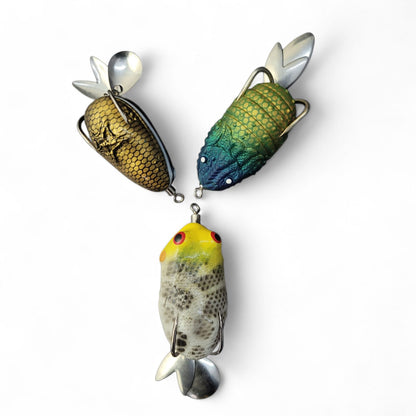 Three colorful fishing lures on a white background