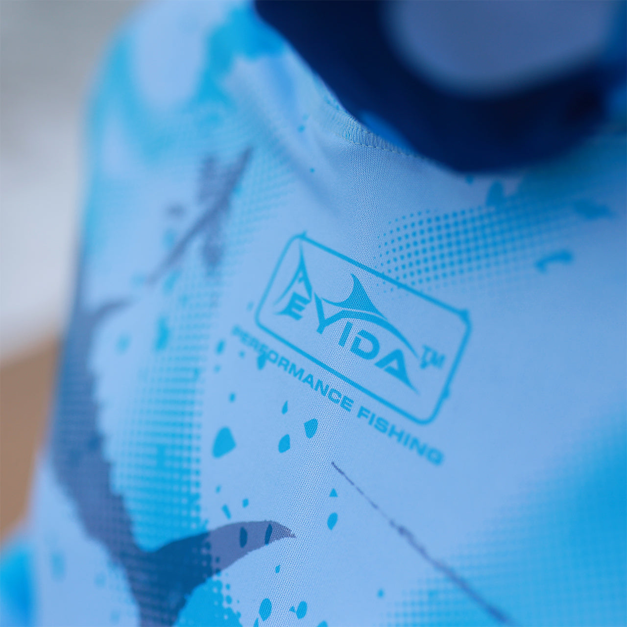 Eyida Oceans Mystery UPF_50_ Hooded Performance Fishing T-Shirt Eyida Logo Chest Close Up